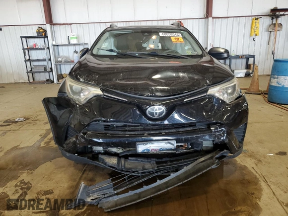 2018 Toyota RAV4 LE with VIN 2T3BFREV7JW717699, listed as a Copart auction lot 60656045 with Not provided miles and Salvage title. Bid and sale history available at DreamBid. Image 5.