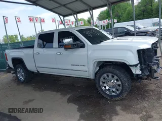 2016 GMC Sierra 2500HD Denali with VIN 1GT12UE86GF267431, listed as a IAAI auction lot 42091770 with 128,525 mi miles and . Bid and sale history available at DreamBid. Image 14.