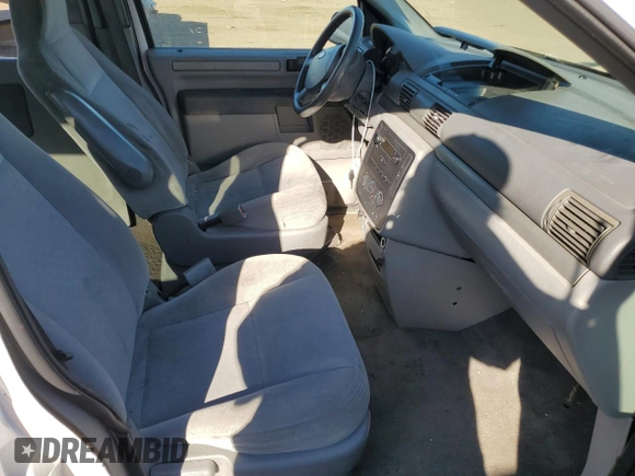 2007 Ford Freestar Cargo z VIN 2FTZA54677BA14812, wystawiony jako Copart lot #78543704 z przebiegiem 258 216 mil mil oraz Szkody całkowita. Historia ofert i sprzedaży dostępna na DreamBid. Obrazek 7.