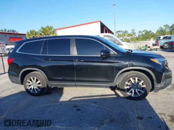 2021 Honda Pilot EX-L with VIN 5FNYF5H55MB044677, listed as a IAAI auction lot 42038704 with 38,684 mi miles and . Bid and sale history available at carsss.com. Image 14.