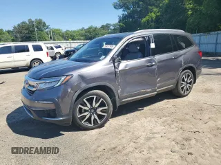 2021 Honda Pilot Touring 7-Passenger z VIN 5FNYF5H67MB014007, wystawiony jako Copart lot #55457395 z przebiegiem 68 661 mil mil oraz Szkoda całkowita • Salvage title. Historia ofert i sprzedaży dostępna na DreamBid. Obrazek 1.