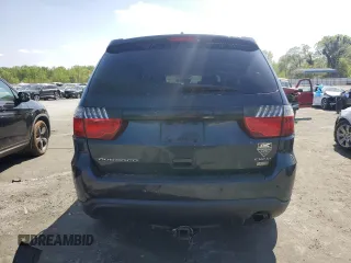 2013 Dodge Durango Crew z VIN 1C4RDHDG3DC700276, wystawiony jako Copart lot #52290215 z przebiegiem 198 243 mil mil oraz Szkody całkowita. Historia ofert i sprzedaży dostępna na DreamBid. Obrazek 6.