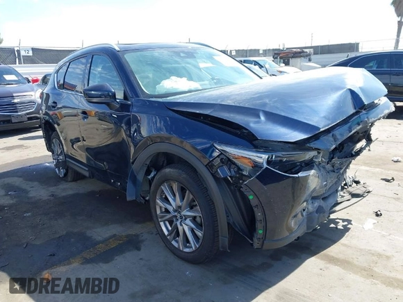2020 Mazda CX-5 Grand Touring with VIN JM3KFADM6L1830093, listed as a IAAI auction lot 41699672 with 66,769 mi miles. Bid and sale history available at carsss.com. Image 1.