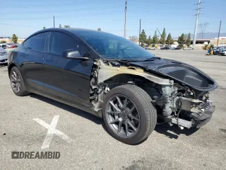 2023 Tesla Model 3 with VIN 5YJ3E1EA4PF562792, listed as a Copart auction lot 55994165 with 17,234 mi miles and Salvage title. Bid and sale history available at DreamBid. Image 4.
