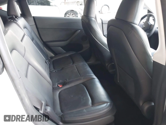 2023 Tesla Model Y Long Range with VIN 7SAYGAEE0PF787216, listed as a IAAI auction lot 41589954 with 17,985 mi miles and . Bid and sale history available at DreamBid. Image 8.