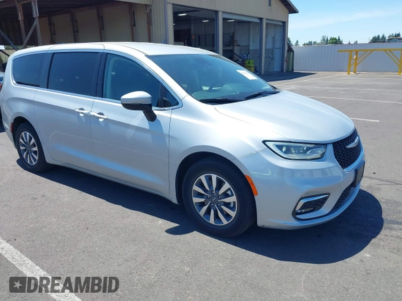 2023 Chrysler Pacifica Hybrid Touring L with VIN 2C4RC1L75PR614460, listed as a IAAI auction lot 42628545 with 68,668 mi miles and . Bid and sale history available at DreamBid. Image 1.