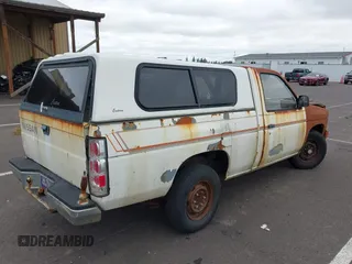 1986 Nissan Hardbody E with VIN JN6ND11S7GW015213, listed as a IAAI auction lot 42588949 with 235,145 mi miles and . Bid and sale history available at DreamBid. Image 4.