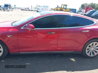 2014 Tesla Model S 60 with VIN 5YJSA1H11EFP37791, listed as a IAAI auction lot 41995504 with 84,371 mi miles and . Bid and sale history available at DreamBid. Image 14.