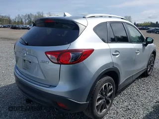 2016 Mazda CX-5 Grand Touring with VIN JM3KE4DYXG0647802, listed as a IAAI auction lot 41996854 with 85,774 mi miles. Bid and sale history available at carsss.com. Image 4.