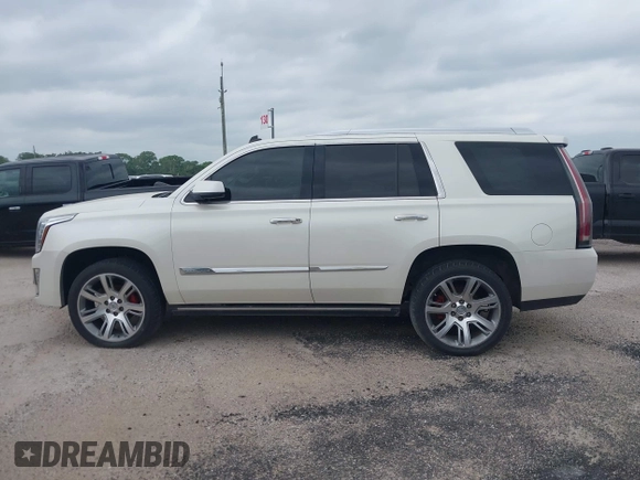 2015 Cadillac Escalade Premium z VIN 1GYS4CKJ4FR216873, wystawiony jako IAAI lot #41677234 z przebiegiem 128 990 mil mil oraz . Historia ofert i sprzedaży dostępna na DreamBid. Obrazek 14.