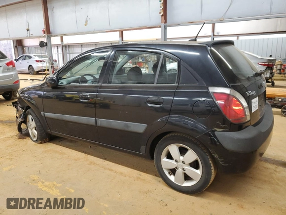 2009 Kia Rio LX with VIN KNADE243896580883, listed as a Copart auction lot 43735505 with 135,726 mi miles and Salvage Title. Bid and sale history available at carsss.com. Image 2.