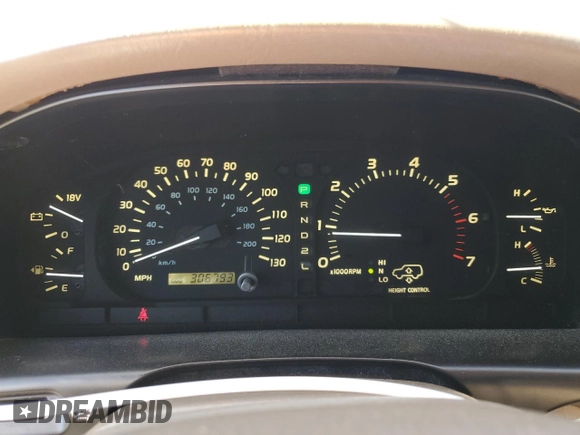 2002 Lexus LX 470 z VIN JTJHT00W723519186, wystawiony jako Copart lot #70190464 z przebiegiem 306 793 mil mil oraz Tytuł czysty. Historia ofert i sprzedaży dostępna na DreamBid. Obrazek 9.
