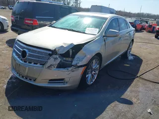 2013 Cadillac XTS Platinum z VIN 2G61U5S37D9209926, wystawiony jako IAAI lot #41754716 z przebiegiem 126 239 mil mil oraz . Historia ofert i sprzedaży dostępna na DreamBid. Obrazek 2.