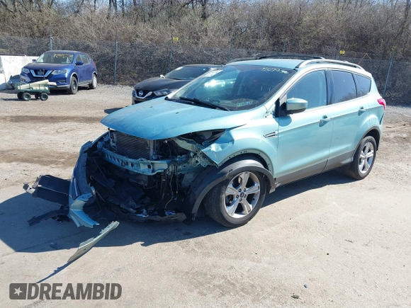 2013 Ford Escape SE with VIN 1FMCU9GX3DUB67956, listed as a IAAI auction lot 41901607 with 102,499 mi miles. Bid and sale history available at carsss.com. Image 2.