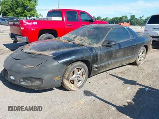 2001 Pontiac Firebird Formula z VIN 2G2FV22G512149316, wystawiony jako IAAI lot #42322668 z przebiegiem 109 585 mil mil oraz . Historia ofert i sprzedaży dostępna na DreamBid. Obrazek 2.
