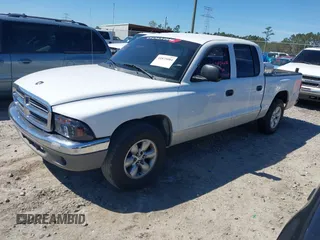 2004 Dodge Dakota SLT with VIN 1D7HL48K54S642754, listed as a IAAI auction lot 41875084 with 242,894 mi miles and . Bid and sale history available at carsss.com. Image 2.