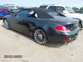 2006 BMW 6 Series 650Ci z VIN WBAEK13456CN77857, wystawiony jako IAAI lot #42306116 z przebiegiem 135 628 mil mil oraz . Historia ofert i sprzedaży dostępna na DreamBid. Obrazek 3.