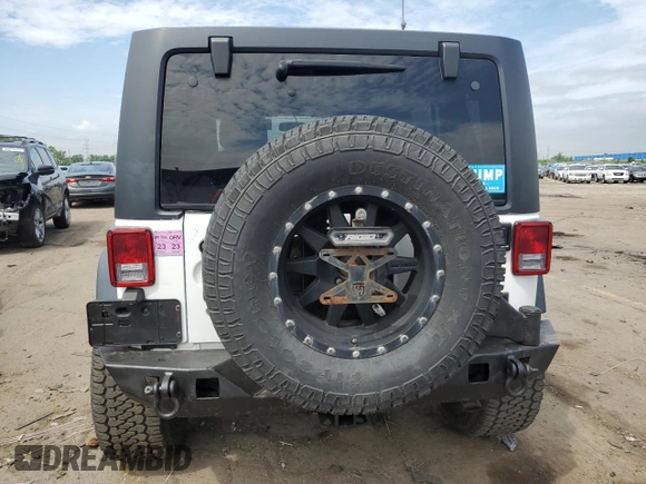 2017 Jeep Wrangler Unlimited Rubicon Recon with VIN 1C4BJWFG5HL511601, listed as a Copart auction lot 62656715 with 86,465 mi miles and Salvage title. Bid and sale history available at DreamBid. Image 6.