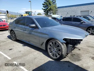 2020 BMW 5 Series 530e with VIN WBAJA9C06LCE66990, listed as a Copart auction lot 48823925 with 57,673 mi miles and Salvage Title. Bid and sale history available at DreamBid. Image 4.