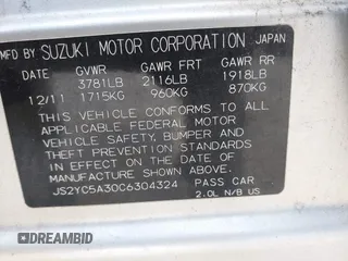 2012 Suzuki SX4 LE with VIN JS2YC5A30C6304324, listed as a IAAI auction lot 41585174 with 111,471 mi miles. Bid and sale history available at carsss.com. Image 9.