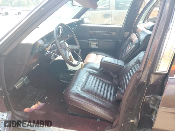 1987 Chevrolet Caprice z VIN 1G1BU51H7H9156079, wystawiony jako Copart lot #60443124 z przebiegiem 44 452 mil mil oraz Szkoda całkowita • Salvage title. Historia ofert i sprzedaży dostępna na DreamBid. Obrazek 7.
