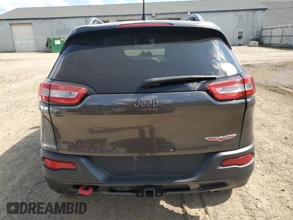 2014 Jeep Cherokee Trailhawk with VIN 1C4PJMBS4EW187085, listed as a Copart auction lot 64106985 with 166,467 mi miles and Clean title. Bid and sale history available at DreamBid. Image 6.