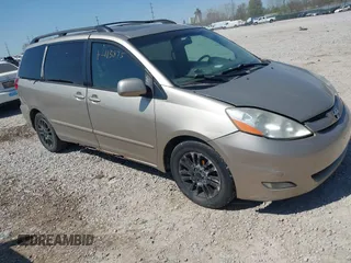 2009 Toyota Sienna XLE with VIN 5TDZK22CX9S257522, listed as a IAAI auction lot 42113875 with 214,873 mi miles. Bid and sale history available at carsss.com. Image 1.