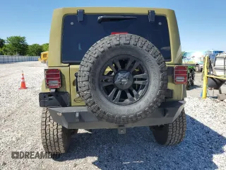 2013 Jeep Wrangler Unlimited Rubicon with VIN 1C4BJWFG0DL587057, listed as a Copart auction lot 57362535 with 102,684 mi miles and Salvage title. Bid and sale history available at DreamBid. Image 6.