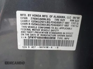 2009 Honda Pilot EX-L with VIN 5FNYF48669B033858, listed as a IAAI auction lot 41918525 with 161,605 mi miles and . Bid and sale history available at carsss.com. Image 9.
