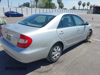 2004 Toyota Camry LE with VIN 4T1BE32K74U300025, listed as a IAAI auction lot 42035954 with 115,203 mi miles. Bid and sale history available at carsss.com. Image 4.
