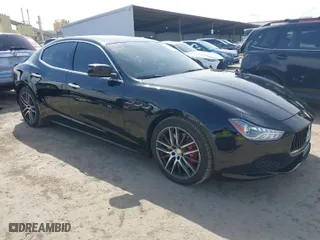 2015 Maserati Ghibli with VIN ZAM57XSA9F1146055, listed as a IAAI auction lot 41814633 with 88,783 mi miles. Bid and sale history available at carsss.com. Image 1.