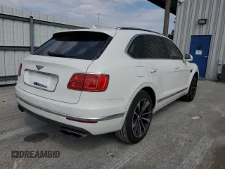 2019 Bentley Bentayga V8 z VIN SJAAM2ZV0KC026362, wystawiony jako Copart lot #54059393 z przebiegiem 31 530 mil mil oraz . Historia ofert i sprzedaży dostępna na DreamBid. Obrazek 3.