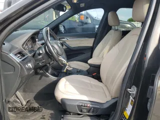 2017 BMW X1 xDrive28i with VIN WBXHT3C32H5F71690, listed as a Copart auction lot 60852375 with 67,475 mi miles and Salvage title. Bid and sale history available at DreamBid. Image 7.