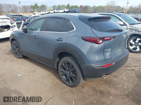 2023 Mazda CX-30 S Carbon Edition with VIN 3MVDMBCM8PM502891, listed as a IAAI auction lot 42050533 with 20,035 mi miles and . Bid and sale history available at DreamBid. Image 3.