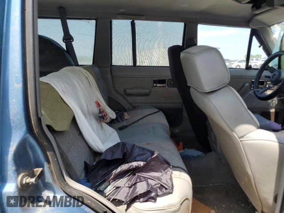 1991 Jeep Cherokee z VIN 1J4FJ58S0ML519252, wystawiony jako Copart lot #55458005 z przebiegiem 152 129 mil mil oraz Szkoda całkowita • Salvage title. Historia ofert i sprzedaży dostępna na DreamBid. Obrazek 10.