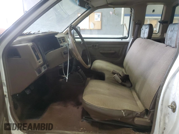 1988 Nissan Hardbody E z VIN 1N6ND16Y3JC351348, wystawiony jako Copart lot #80864914 z przebiegiem 184 397 mil mil oraz Szkody całkowita. Historia ofert i sprzedaży dostępna na DreamBid. Obrazek 7.