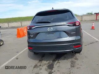 2021 Mazda CX-9 Sport with VIN JM3TCBBY7M0520437, listed as a IAAI auction lot 42022562 with 77,063 mi miles and . Bid and sale history available at DreamBid. Image 16.