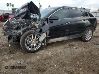 2014 Cadillac SRX Performance Collection z VIN 3GYFNFE34ES659047, wystawiony jako Copart lot #88736285 z przebiegiem Nie podano mil oraz Szkoda całkowita • Salvage title. Historia ofert i sprzedaży dostępna na DreamBid. Obrazek 1.