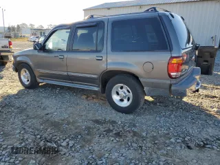 1999 Ford Explorer XL with VIN 1FMZU34X8XUC31019, listed as a Copart auction lot 87831635 with 220,683 mi miles and Salvage title. Bid and sale history available at DreamBid. Image 2.