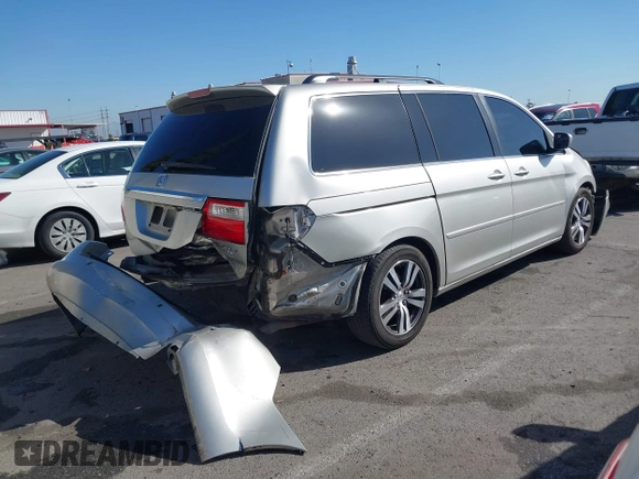 2005 Honda Odyssey TOURING with VIN 5FNRL38865B128519, listed as a IAAI auction lot 41830182 with 171,010 mi miles. Bid and sale history available at carsss.com. Image 14.