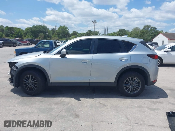 2017 Mazda CX-5 Sport with VIN JM3KFABLXH0135560, listed as a IAAI auction lot 42062016 with 153,416 mi miles. Bid and sale history available at carsss.com. Image 15.