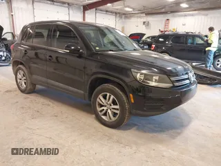 2014 Volkswagen Tiguan SE z VIN WVGAV3AX9EW614094, wystawiony jako IAAI lot #42350601 z przebiegiem 128 996 mil mil oraz . Historia ofert i sprzedaży dostępna na DreamBid. Obrazek 1.