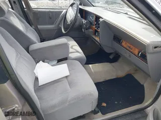 1995 Buick Century Special SJ with VIN 1G4AG55M4S6408666, listed as a IAAI auction lot 41864315 with 128,201 mi miles. Bid and sale history available at carsss.com. Image 5.