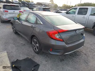 2019 Honda Civic Sedan LX with VIN 19XFC2F60KE018100, listed as a IAAI auction lot 41908486 with 124,357 mi miles. Bid and sale history available at carsss.com. Image 3.