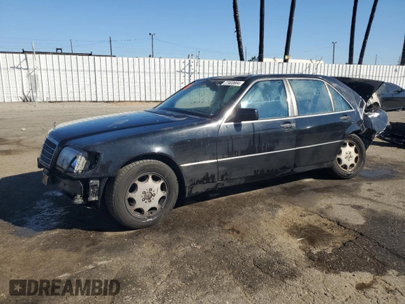 1994 Mercedes-Benz S with VIN WDBGA51E2RA184222, listed as a Copart auction lot 77403664 with 109,428 mi miles and Salvage Title. Bid and sale history available at DreamBid. Image 1.
