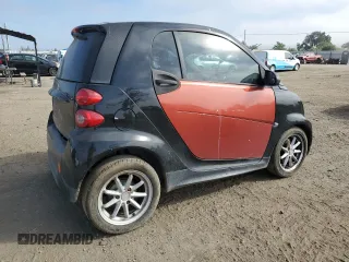 2014 Smart fortwo Pure z VIN WMEEJ3BA1EK753320, wystawiony jako Copart lot #55665555 z przebiegiem 71 305 mil mil oraz Szkody całkowita. Historia ofert i sprzedaży dostępna na DreamBid. Obrazek 3.