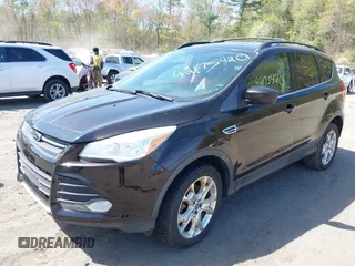 2013 Ford Escape SE with VIN 1FMCU9GX3DUA51379, listed as a IAAI auction lot 42175420 with 166,522 mi miles. Bid and sale history available at carsss.com. Image 2.