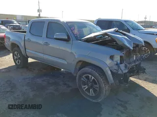 2018 Toyota Tacoma SR5 with VIN 5TFAZ5CN1JX062501, listed as a IAAI auction lot 41450533 with 99,872 mi miles and . Bid and sale history available at DreamBid. Image 1.