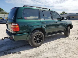 2000 Toyota Land Cruiser with VIN JT3HT05J8Y0085990, listed as a Copart auction lot 76706864 with 329,562 mi miles and Salvage Title. Bid and sale history available at carsss.com. Image 3.