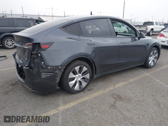 2021 Tesla Model Y Long Range with VIN 5YJYGDEEXMF092901, listed as a IAAI auction lot 42164866 with 61,240 mi miles and . Bid and sale history available at carsss.com. Image 4.